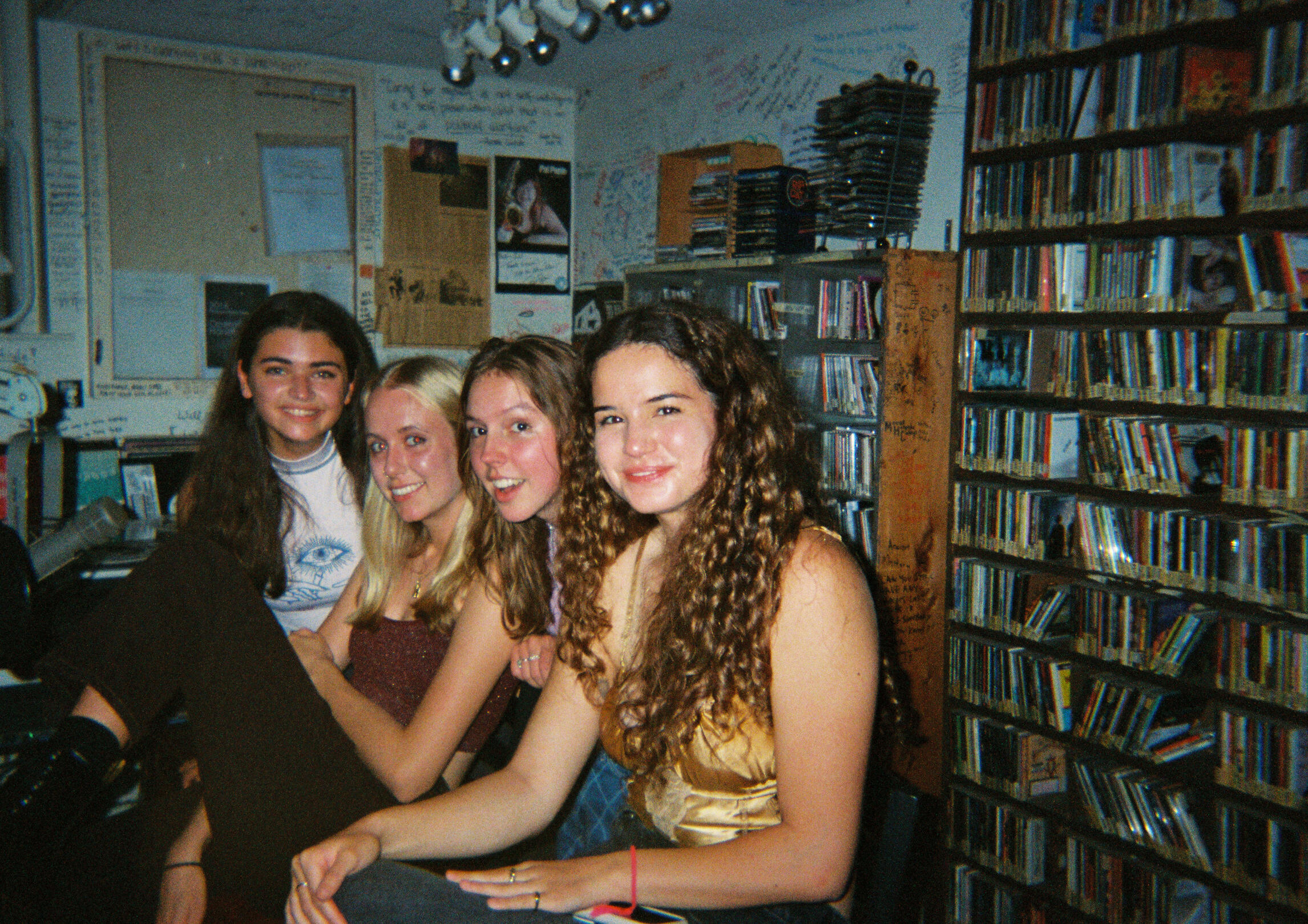 Four students sitting in the broadcast studio