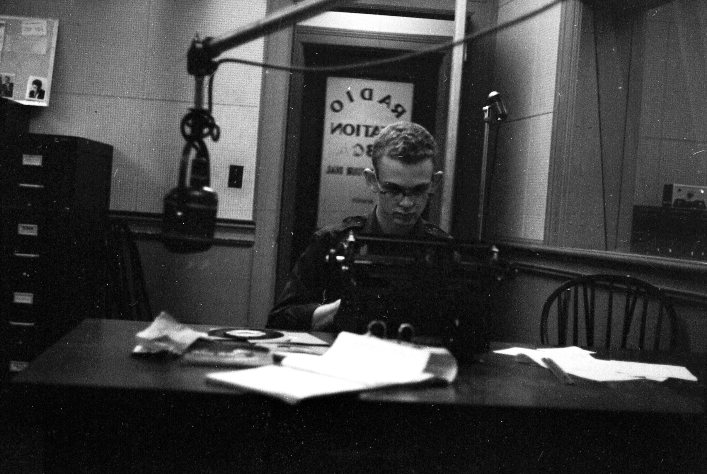 Unidentified student writing a script on a typewriter.